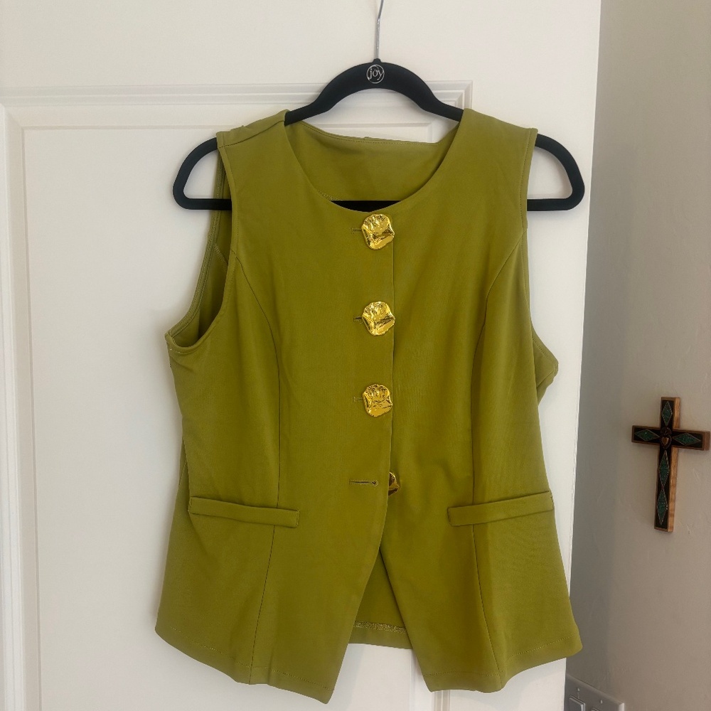 CLASSY VEST WITH GREEN WITH BOLD GOLD BUTTON .